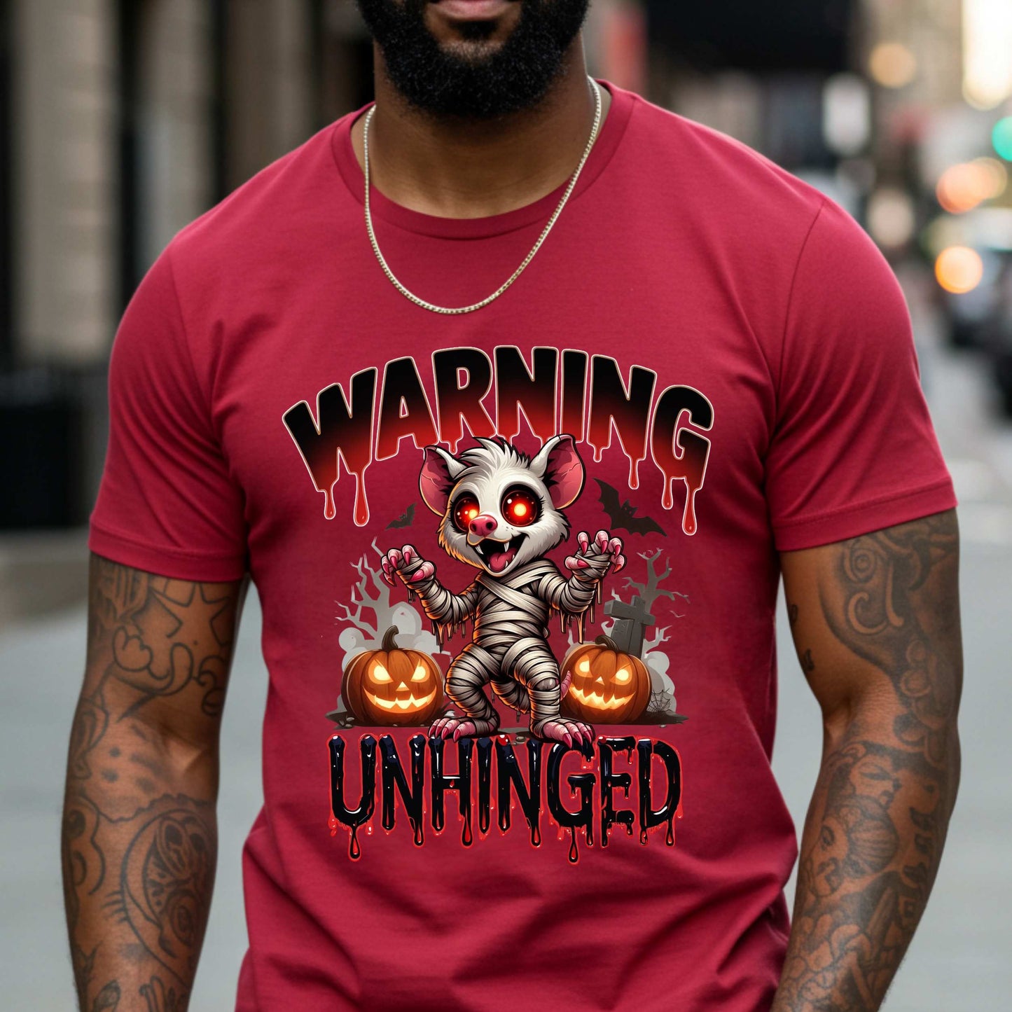 Wrapped in mummy rags with glowing red eyes and the energy of a sleep-deprived raccoon on espresso, this Warning: Unhinged tee is perfect for anyone who thrives on spooky vibes, sarcasm, and just a little bit of feral energy. Whether you're scaring off the normies or just embracing your inner mess, this is your new Halloween uniform.