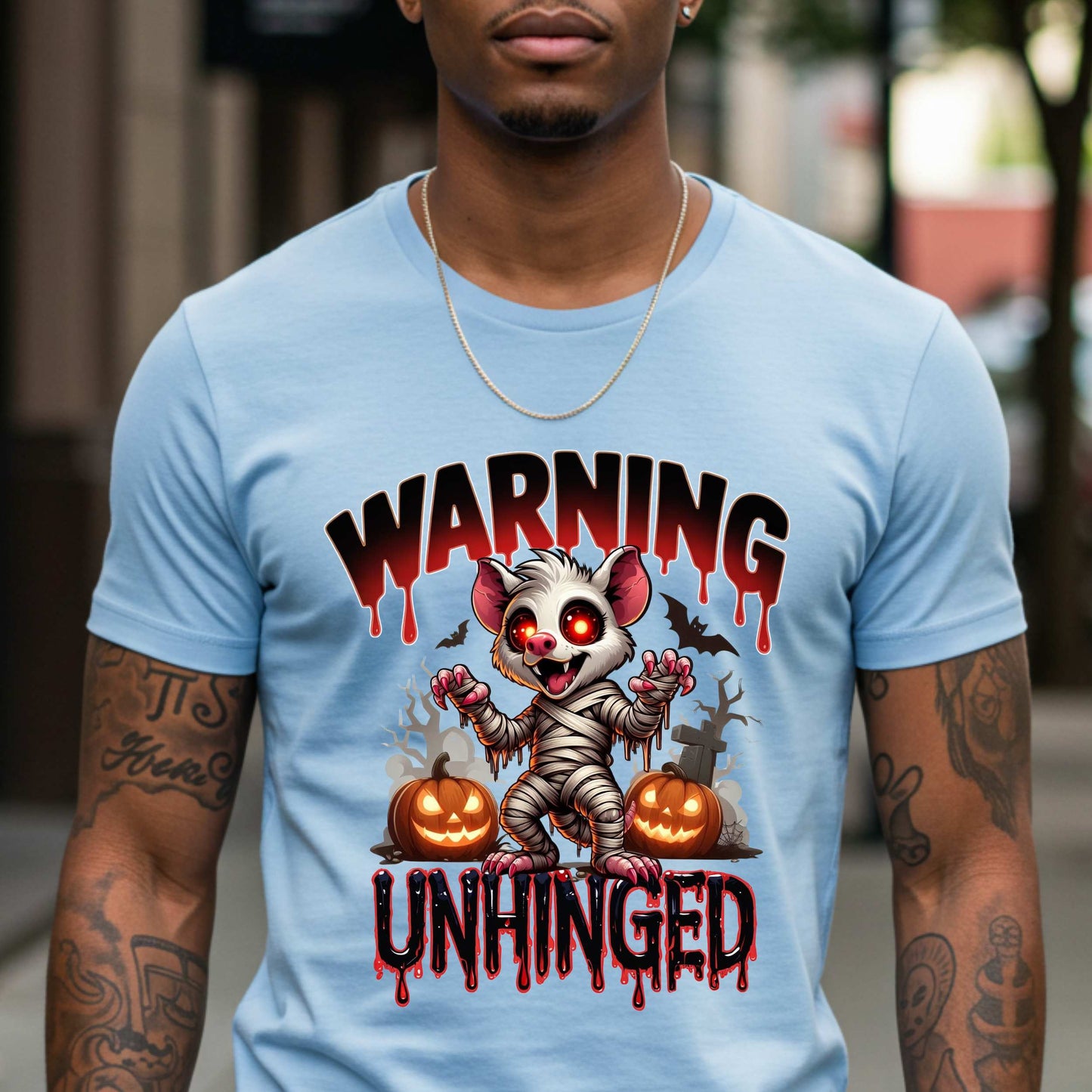 Wrapped in mummy rags with glowing red eyes and the energy of a sleep-deprived raccoon on espresso, this Warning: Unhinged tee is perfect for anyone who thrives on spooky vibes, sarcasm, and just a little bit of feral energy. Whether you're scaring off the normies or just embracing your inner mess, this is your new Halloween uniform.