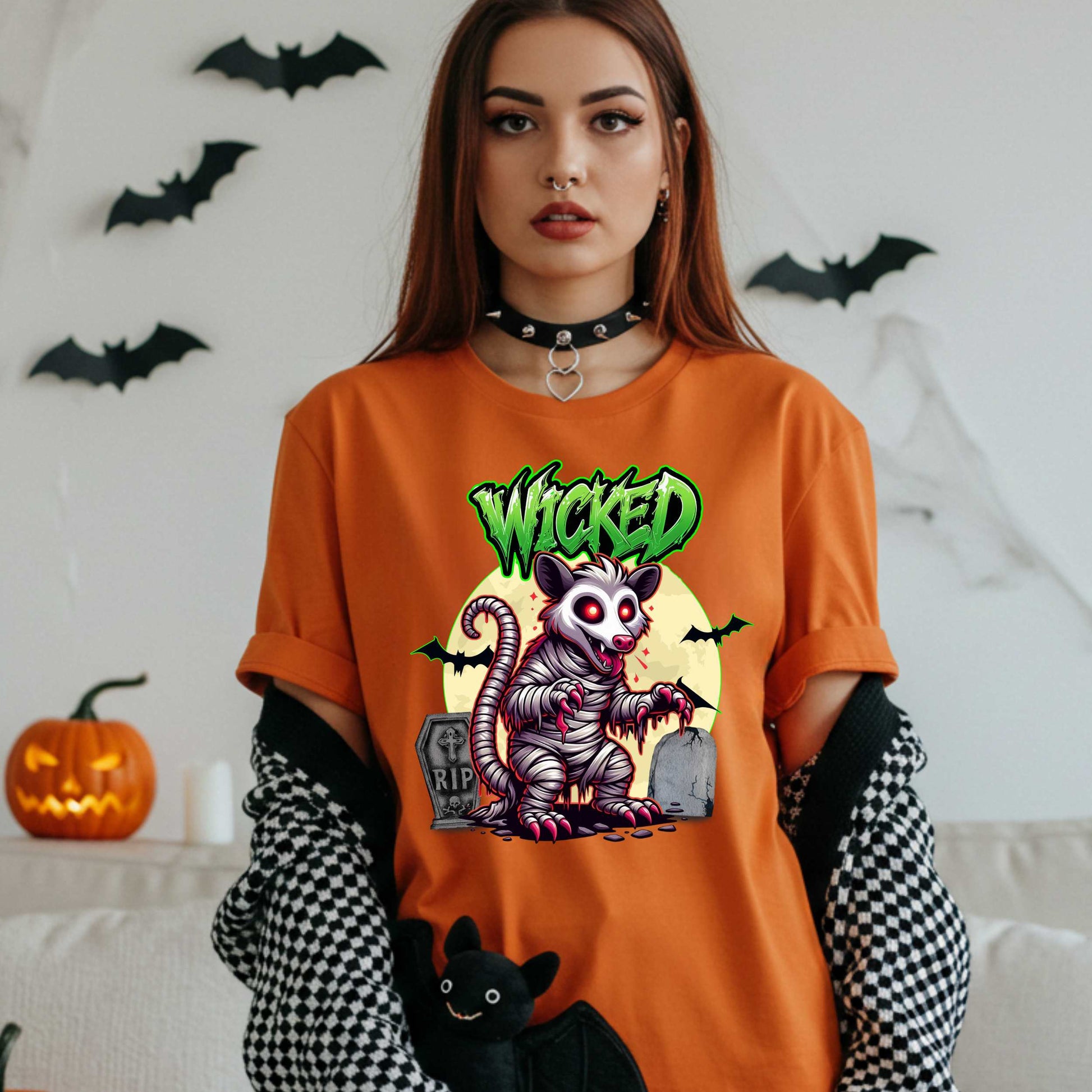 This unisex Wicked Opossum tee brings the perfect mix of spooky and unhinged. Great for horror fans, goth goblins, and anyone who appreciates a lil’ chaos with their candy corn.