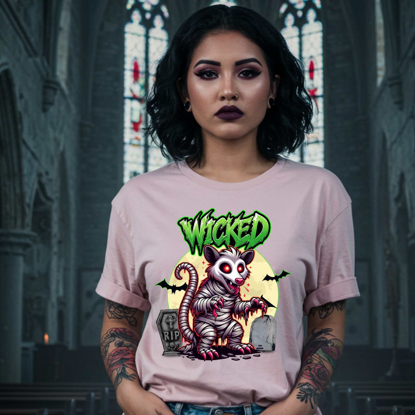 This unisex Wicked Opossum tee brings the perfect mix of spooky and unhinged. Great for horror fans, goth goblins, and anyone who appreciates a lil’ chaos with their candy corn.