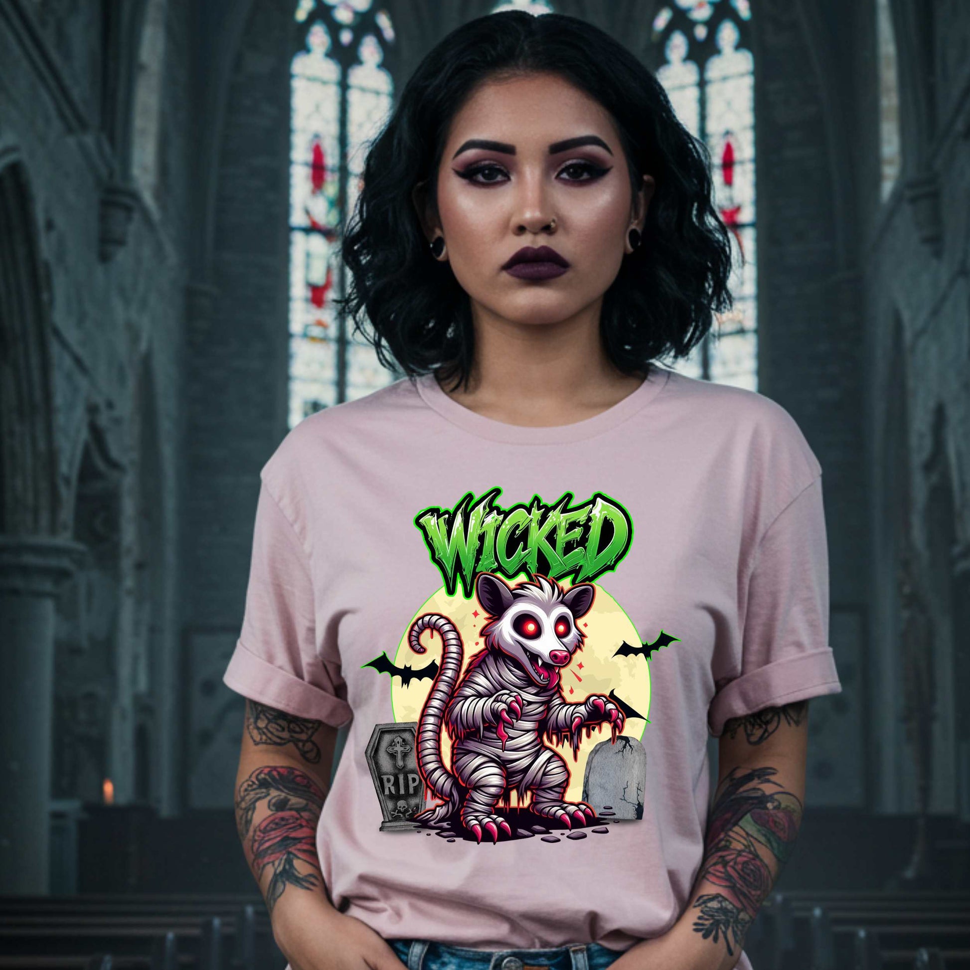 This unisex Wicked Opossum tee brings the perfect mix of spooky and unhinged. Great for horror fans, goth goblins, and anyone who appreciates a lil’ chaos with their candy corn.