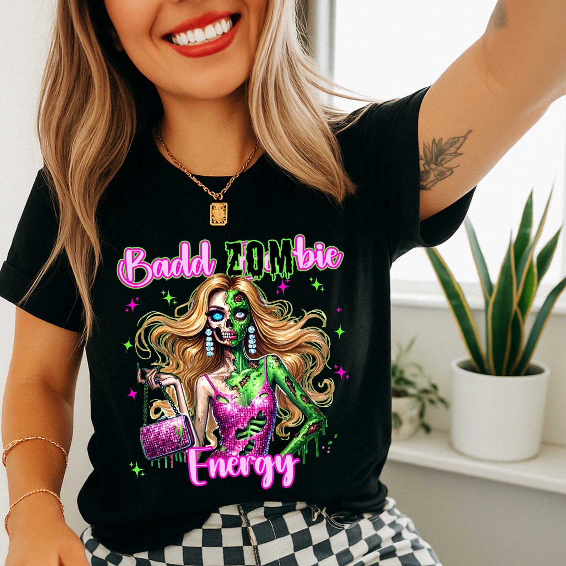 Brains, but make it fashion. This Badd Zombie Energy tee is for the girls who slay… even in the afterlife. Rocking a glittery pink dress, designer handbag, and enough undead glam to raise the dead, this zombie babe is dripping in sass (and maybe a little ooze).