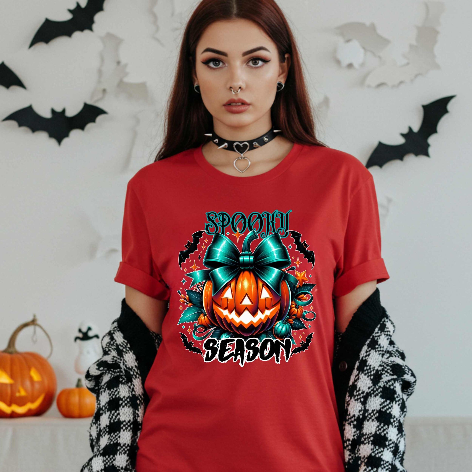 Step aside basic witches, this pumpkin came to SLAY. Our Spooky Season tee brings the perfect mix of creepy and cute—featuring a fierce jack-o’-lantern crowned with a bold teal bow and surrounded by gothic glam accents.